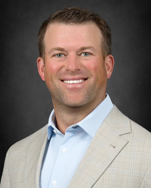 Travis Isom, Chief Operating Officer